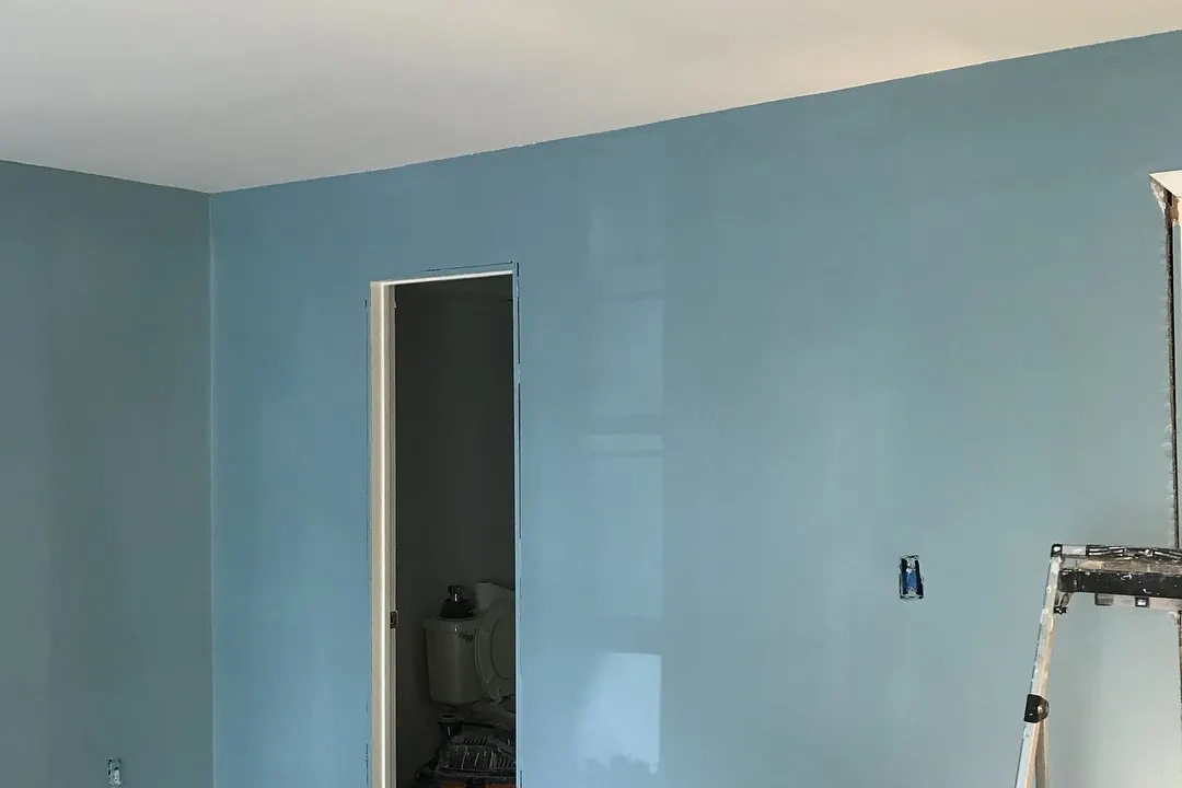 Room with light blue painted walls in Tree Bridges, NJ